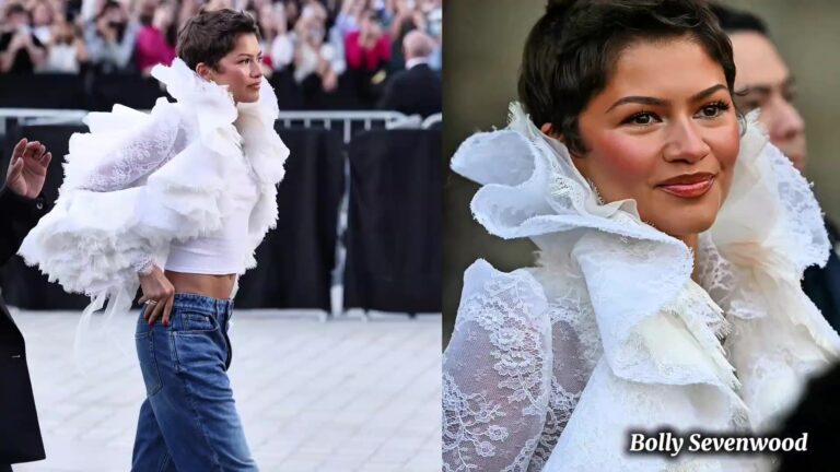 Zendaya met een korte pixie en een witte kanten ruchesblouse bij de show van Louis Vuitton in Parijs, uit een video van Bolly Sevenwood